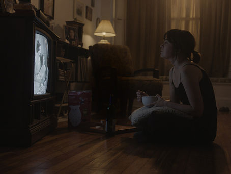 Still from Spite showing Masha Cima haunted in her childhood home.