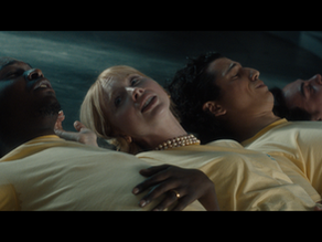 Business professionals in a desert setting look tense and alarmed.