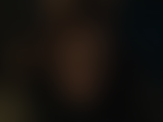 Luke Baines stares coldly with blood-splattered clothes in No Tears in Hell.