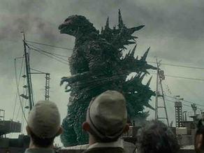 Godzilla emerging near the Statue of Liberty in a destruction scene.