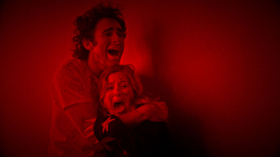 Chloe Cherry in a dimly lit barn scene from the horror film Blood Barn.