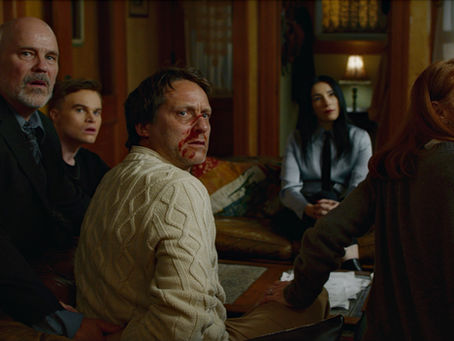 A tense sci-fi thriller scene from The Strange Dark featuring a family confronting mysterious strangers.