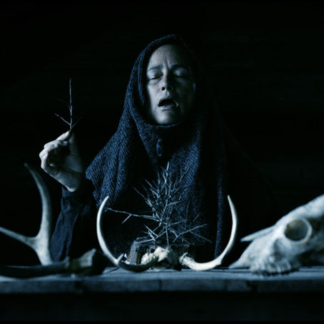 Still from Mother of Flies showing Zelda Adams in a haunting, nature-infused setting that reflects the film’s folk-horror atmosphere.