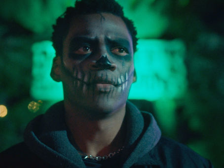 Grayson Gwaze stands inside a haunted attraction in The Haunted Forest trailer still.