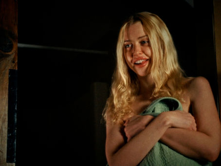 Teens at a barn party in 1980s-inspired horror film Blood Barn.