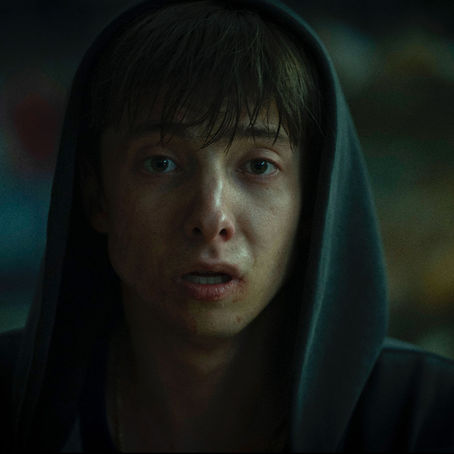 Two teenage boys embrace in the dark on the official poster for Leviticus.