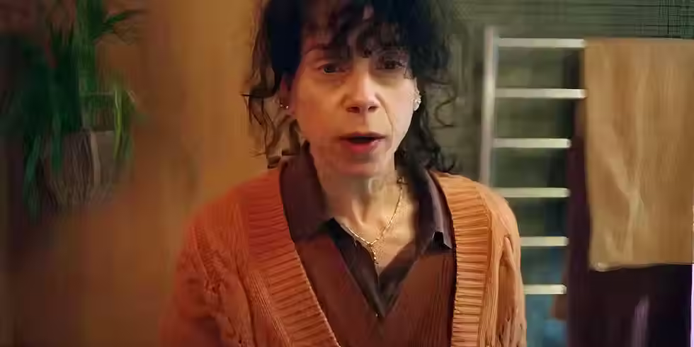 Sally Hawkins stares solemnly in a dimly lit scene from Bring Her Back.