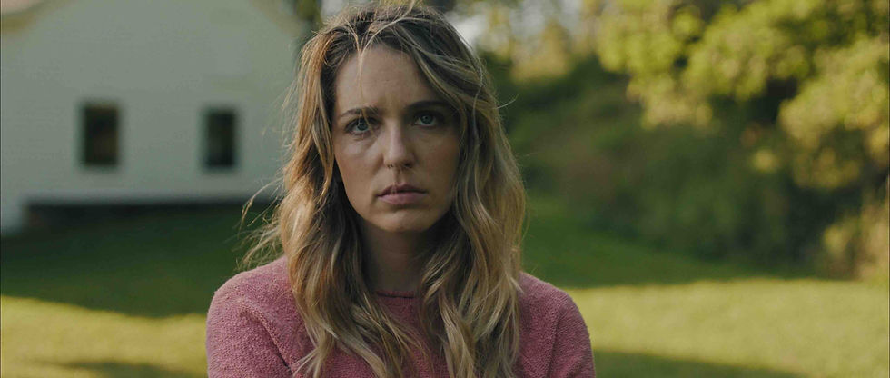 Jessica Rothe looking distressed in a dimly lit room in Affection