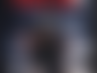 Still image from The Bad Visitor 2 showing David and Vanessa looking over their shoulders in fear at their lakeside home.