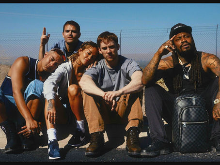 Joe Cole in a neon-lit Las Vegas scene from the crime thriller He Bled Neon.