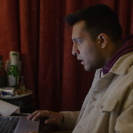 Still from indie horror film I Know Exactly How You Die featuring a motel setting and tense atmosphere.