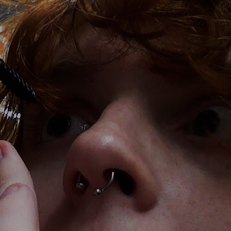 Two grungy young women using old cameras in lo-fi horror film Divine Hammer