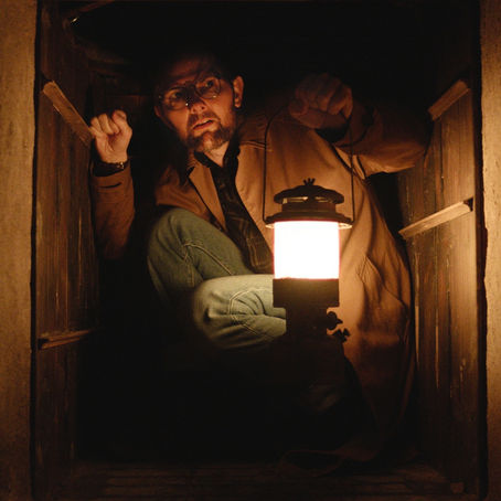 Adam Scott in a dark corridor scene from Damian McCarthy’s horror film Hokum.