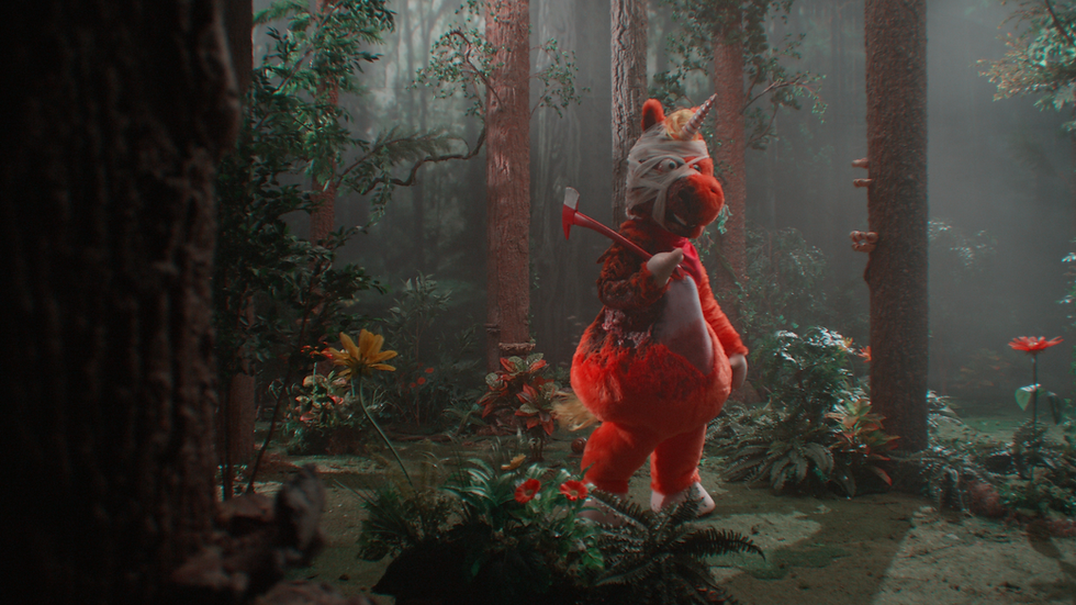 Promotional image of Buddy, the orange unicorn from the upcoming horror film Buddy.
