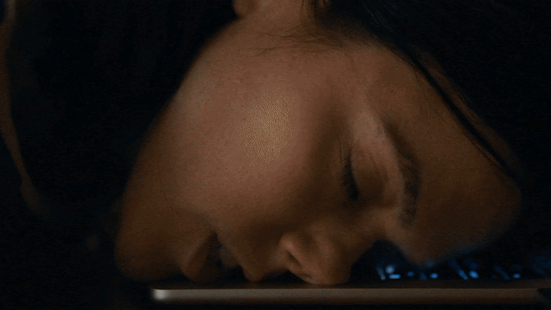 Trailer still from the horror film Undertone featuring a podcaster haunted by sinister audio recordings.