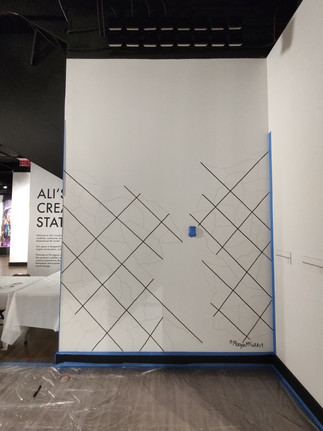 Colorful primary colors painted in boxes by community members