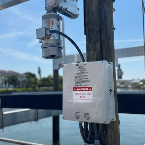 Tec IV A/C boat lift control box installed on a private dock in Belleair, FL – dockside power installation