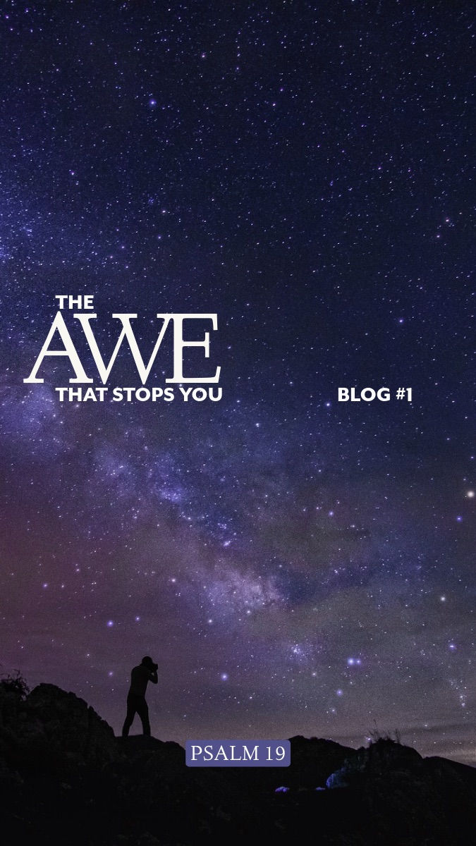 A breathtaking view of the Milky Way stretching across a clear night sky, with a solitary man standing in silhouette beneath the stars, gazing upward in awe.