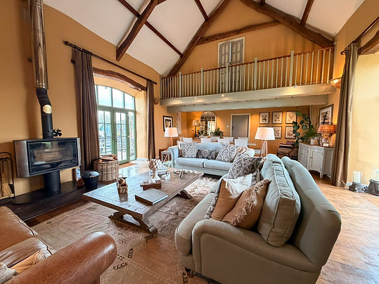 ysgubor-degwm-spacious-vaulted-lounge-wood-burning-stove.jpg