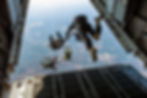 A group of skydivers leaving an airplane