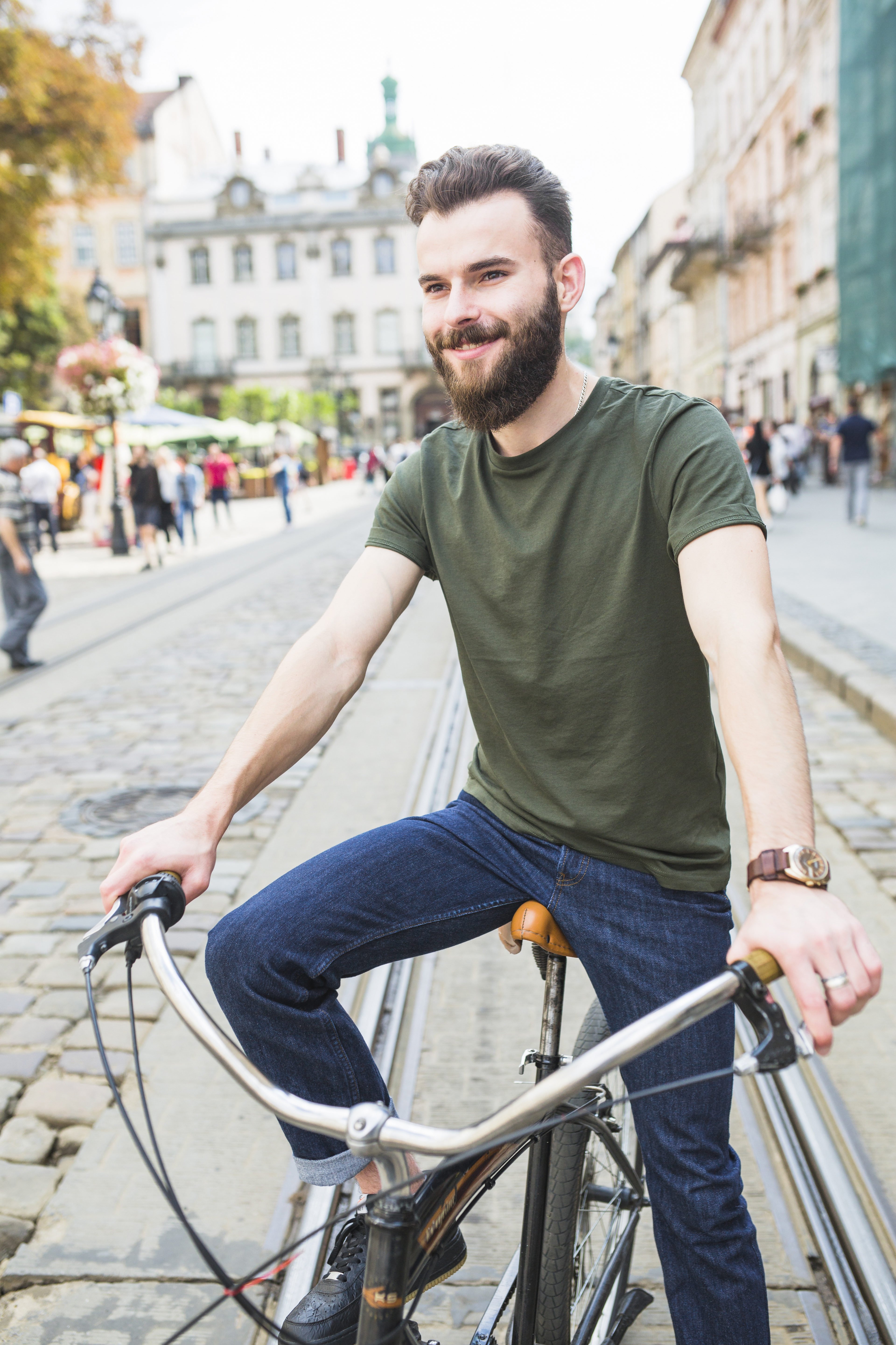 portrait-happy-young-man-with-bicycle.jpg