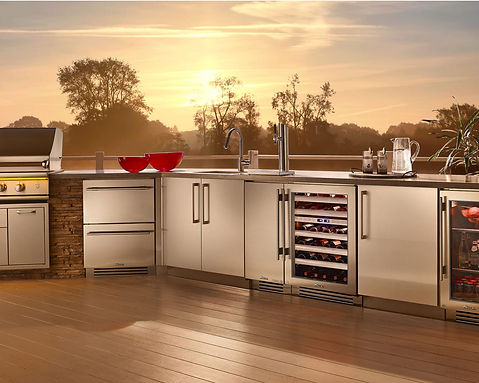 Elite Systems Experts technician repairing an outdoor wine cooler and beverage fridge