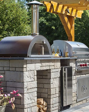 Elite Systems Experts technician repairing a Viking outdoor BBQ grill and Sub-Zero patio refrigerator in Westchester, NY—comprehensive outdoor appliance repair service
