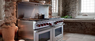 Elite Systems Experts technician repairing a Wolf stove to restore precise cooking performance and premium kitchen functionality.