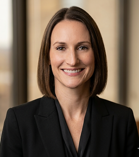 A woman with a shoulder-length brown bob parted just left of center, smiling. It's Lisa.