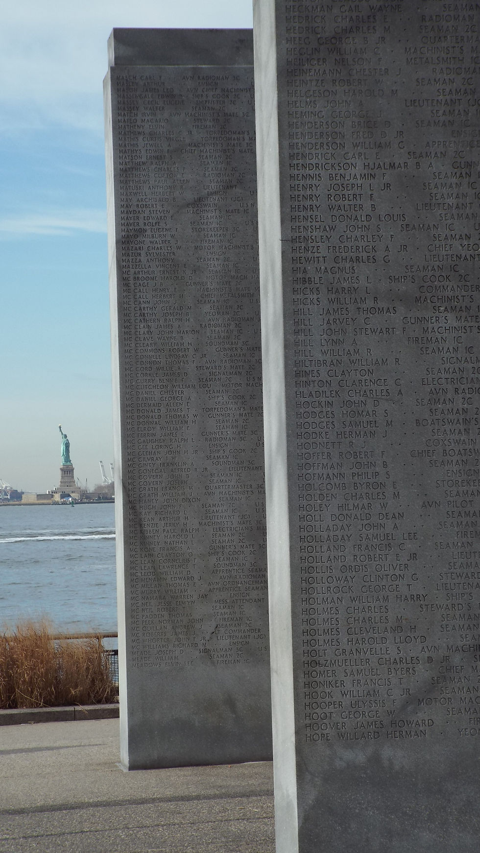 The Statue of Liberty viewed from a WWII memorial in Battery Park