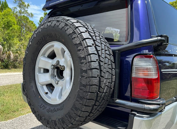 Rear view of 1996 Toyota Hilux Surf SSR-G for sale, right hand drive 4WD JDM SUV with original Surf graphics