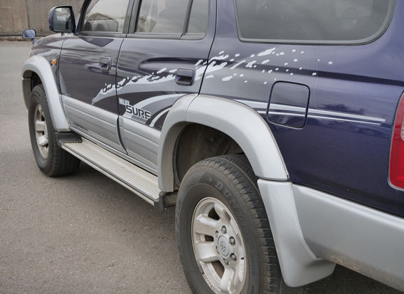 Side profile 1996 Toyota Hilux Surf SSR-G Wide JDM SUV blue two tone