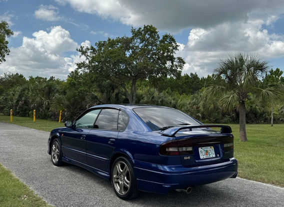 2001 Subaru Legacy B4 RSK rear view in navy blue with factory spoiler and JDM tail lights