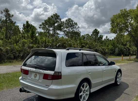 1997 Mitsubishi Legnum VR-4 Type S for sale – White Pearl exterior, Black Leather interior, AWD, 2.5L twin-turbo V6, automatic transmission, ABS, airbags, power windows, and air conditioning. A rare and high-performance sports wagon in excellent condition.