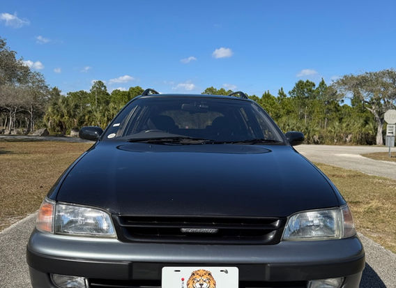 1994 Toyota Caldina TZ 4WD JDM wagon for sale USA front view black gray two tone clean headlights bumper