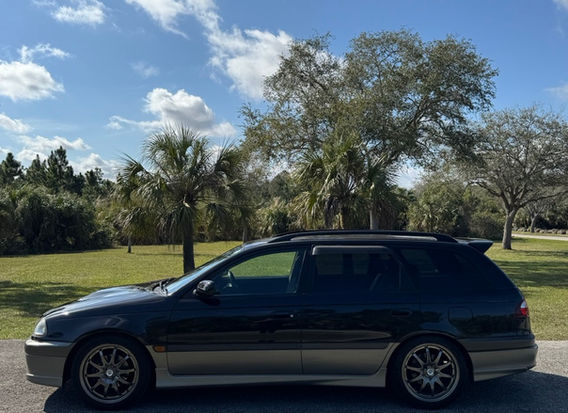 1998 Toyota Caldina GT-T for sale – Turbocharged AWD JDM wagon with alloy wheels and aerodynamic design.