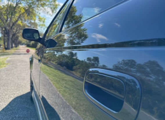 1998 Toyota Caldina GT-T for sale – Turbocharged AWD JDM wagon with alloy wheels and aerodynamic design.