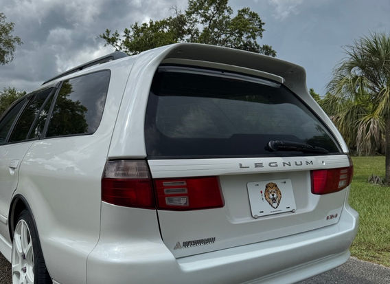 1997 Mitsubishi Legnum VR-4 Type S for sale – White Pearl exterior, Black Leather interior, AWD, 2.5L twin-turbo V6, automatic transmission, ABS, airbags, power windows, and air conditioning. A rare and high-performance sports wagon in excellent condition.