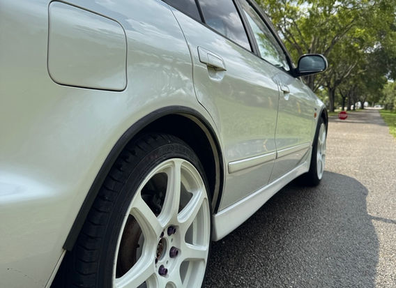 1997 Mitsubishi Legnum VR-4 Type S for sale – White Pearl exterior, Black Leather interior, AWD, 2.5L twin-turbo V6, automatic transmission, ABS, airbags, power windows, and air conditioning. A rare and high-performance sports wagon in excellent condition.