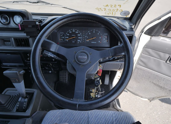 Close-up of odometer on a 1994 Mitsubishi Delica Star Wagon diesel 4x4 reading 188,456 km – low mileage for a reliable JDM adventure van.
