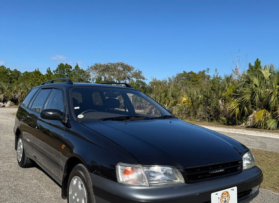 1994 Toyota Caldina TZ 4WD JDM wagon for sale USA front view black gray two tone clean headlights bumper