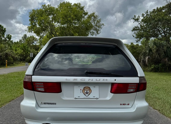 1997 Mitsubishi Legnum VR-4 Type S for sale – White Pearl exterior, Black Leather interior, AWD, 2.5L twin-turbo V6, automatic transmission, ABS, airbags, power windows, and air conditioning. A rare and high-performance sports wagon in excellent condition.