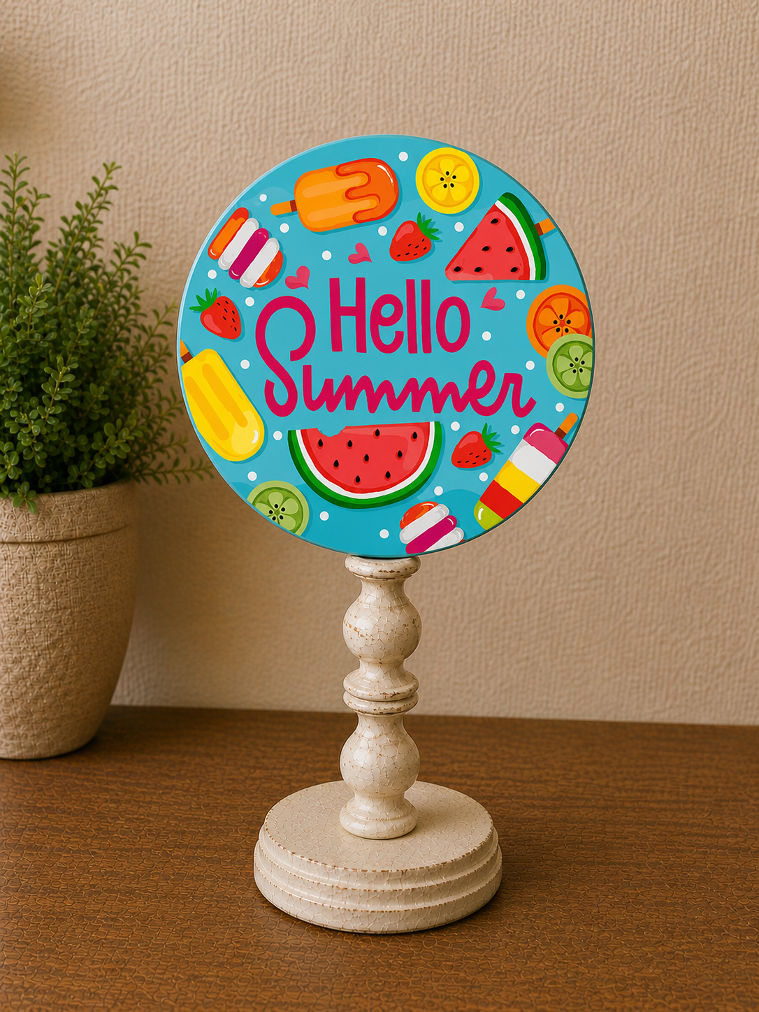 Rustic interchangeable magnet pedestal displaying colorful “Hello Summer” round magnet on tabletop