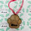 Thumbnail: Personalized wooden paw-shaped Christmas bauble