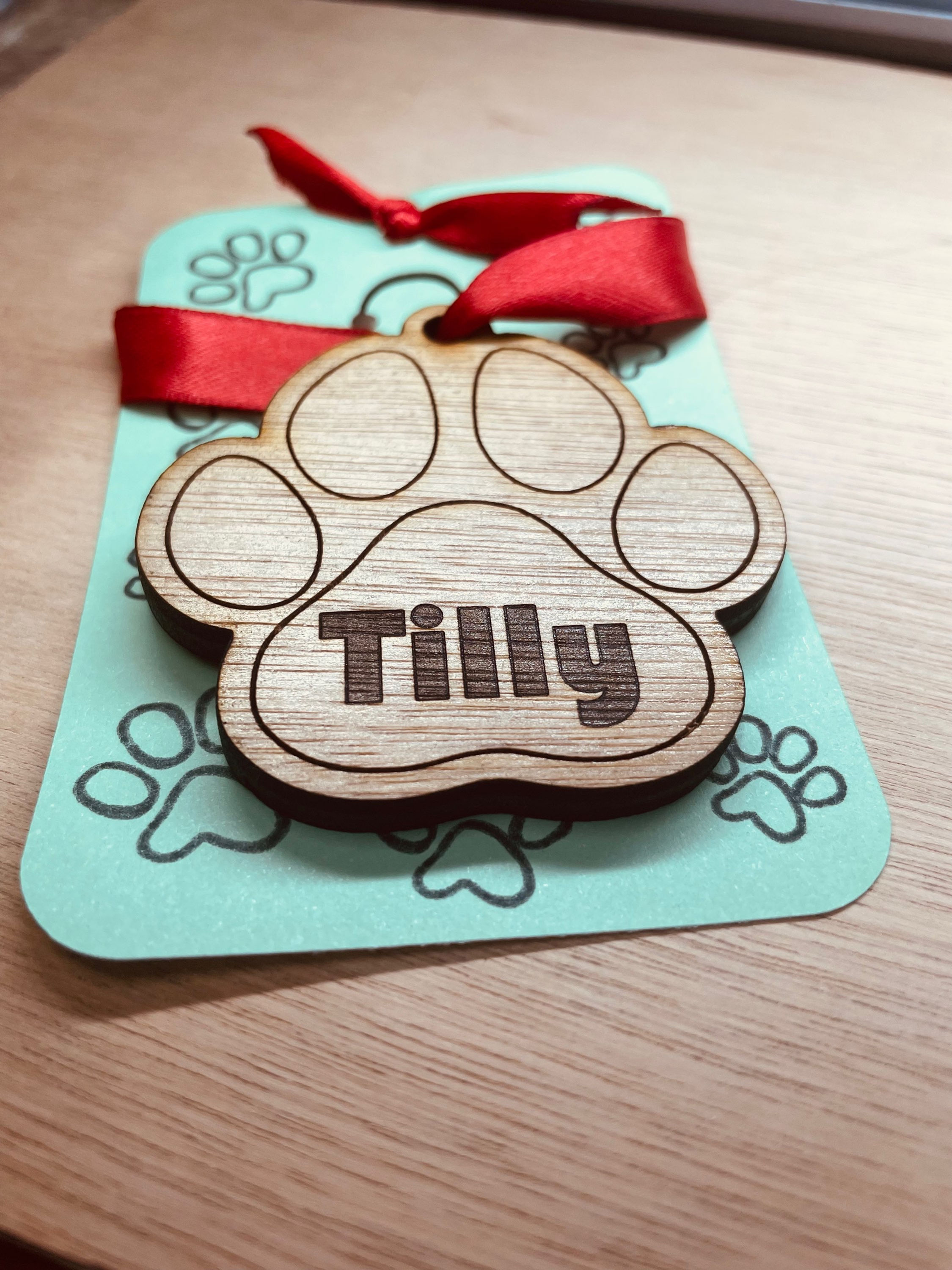 Personalized wooden paw-shaped Christmas bauble