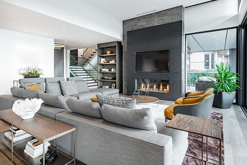 Luxurious and elegant living room with slate and dark yellow tones.jpg