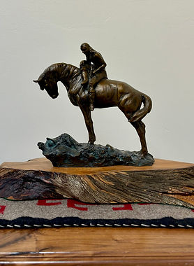 bronze sculpture by Jeff Wolf of an Indian riding a horse at gold river gallery