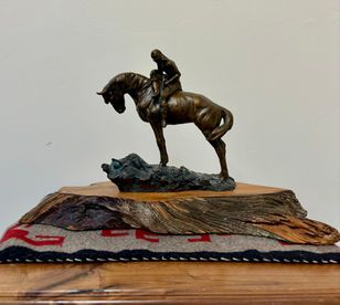 sculpture of an Indian riding a horse