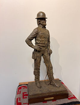 Sculpture of a lineman by Jeff Wolf at Gold River Gallery