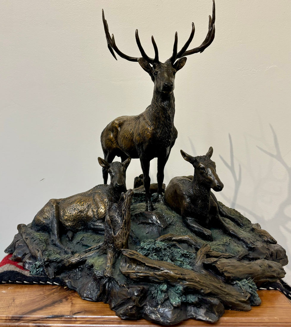 a statue of three deer standing and laying on a rock, bronze sculpture, gold river gallery